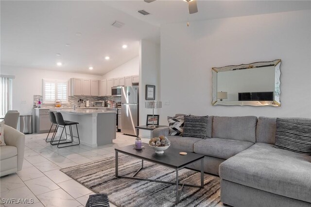 living room featuring visible vents, high vaulted ceiling, marble finish floor, a ceiling fan, and recessed lighting