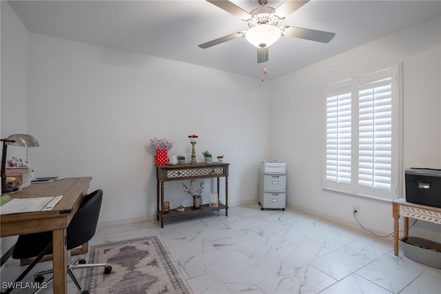 office with baseboards, marble finish floor, and a ceiling fan