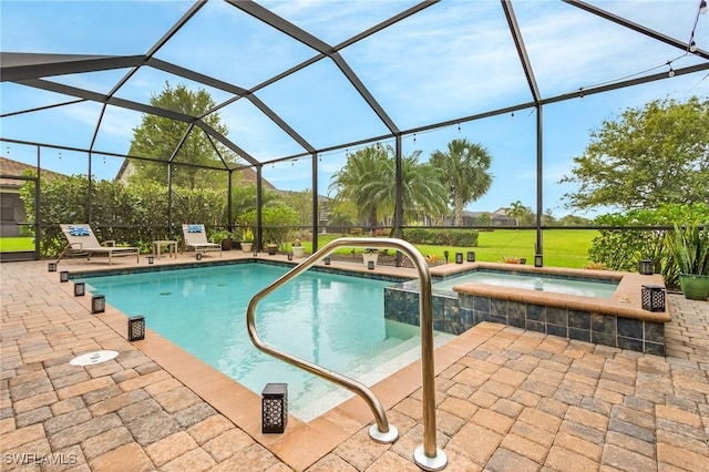 view of pool featuring a patio area, a lanai, and a pool with connected hot tub