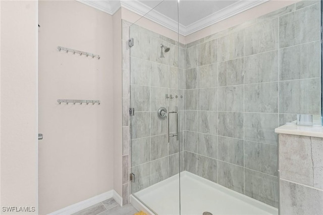 full bathroom with a shower stall, baseboards, and ornamental molding