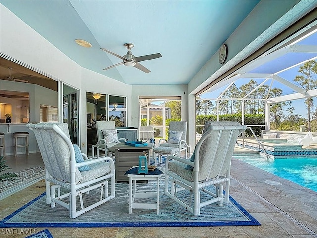 exterior space featuring a ceiling fan, glass enclosure, outdoor lounge area, an outdoor pool, and an in ground hot tub