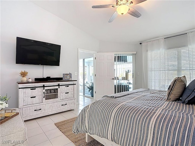 bedroom with light tile patterned floors, access to outside, ceiling fan, and vaulted ceiling