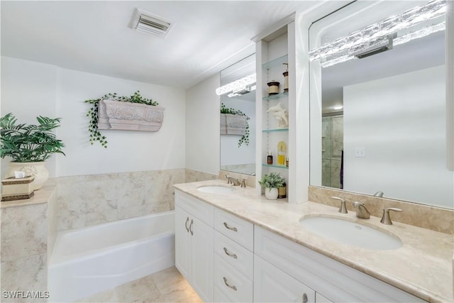 bathroom with a bath, visible vents, a stall shower, and a sink