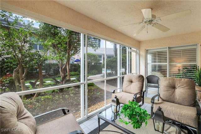 sunroom with a ceiling fan