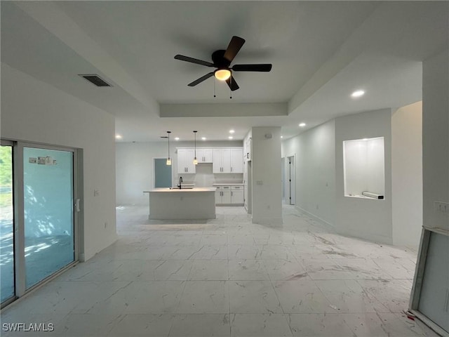 unfurnished living room with recessed lighting, marble finish floor, visible vents, and ceiling fan