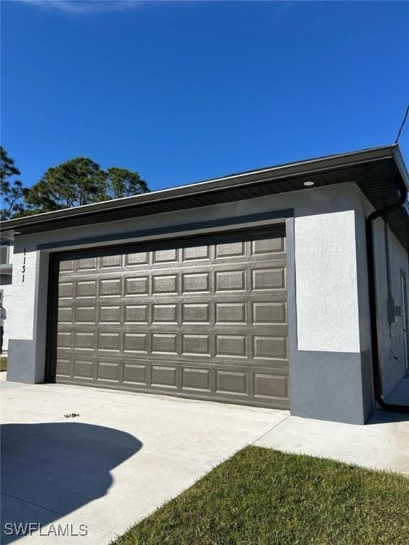 garage featuring driveway