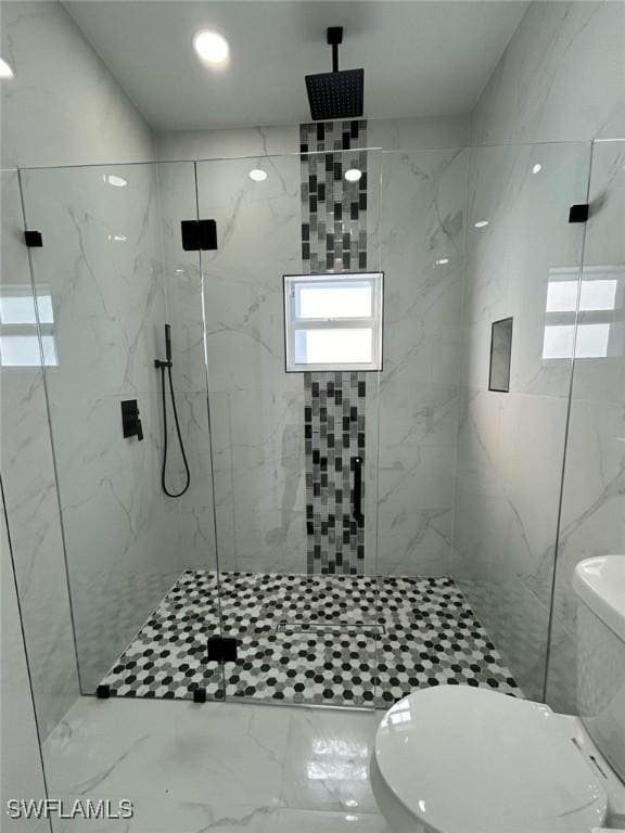 full bathroom with toilet, marble finish floor, and a marble finish shower