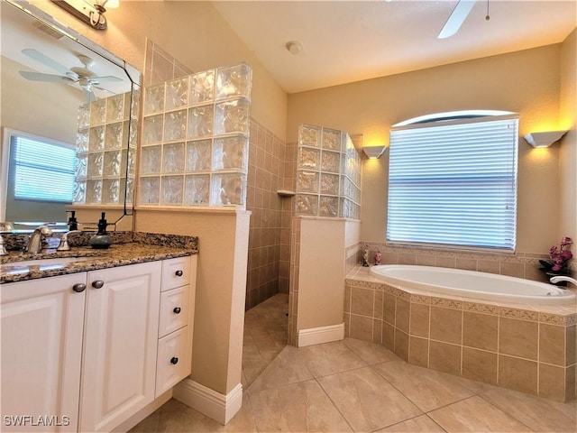 11573 SW Dallas Dr N, Lake Suzy, FL 34269 - full bathroom featuring a wealth of natural light, a ceiling fan, and vanity
