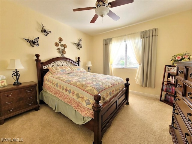 11573 SW Dallas Dr N, Lake Suzy, FL 34269 - bedroom featuring ceiling fan, light carpet, and baseboards
