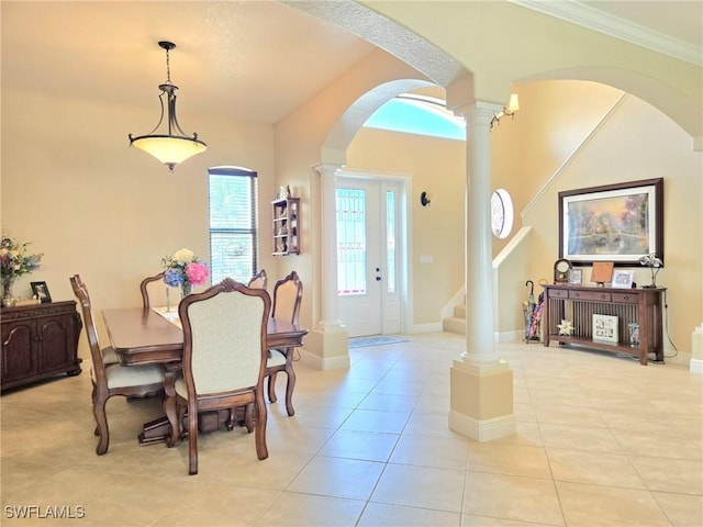 11573 SW Dallas Dr N, Lake Suzy, FL 34269 - dining space featuring light tile patterned flooring, decorative columns, baseboards, ornamental molding, and arched walkways