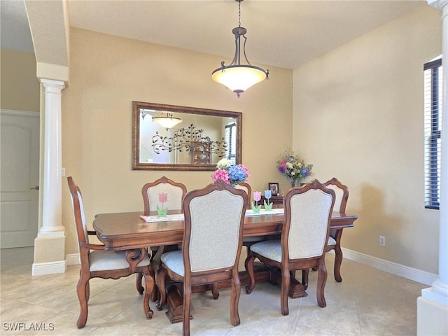 11573 SW Dallas Dr N, Lake Suzy, FL 34269 - dining room featuring baseboards, ornate columns, and light tile patterned flooring