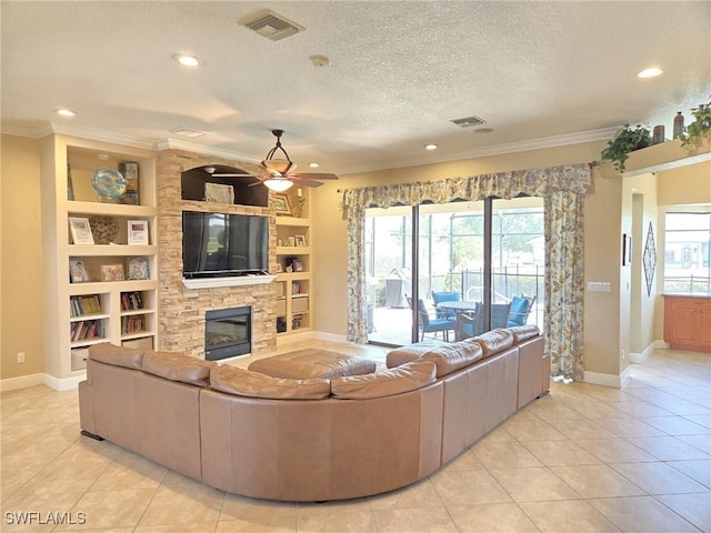 11573 SW Dallas Dr N, Lake Suzy, FL 34269 - living room with a fireplace, visible vents, ornamental molding, and baseboards