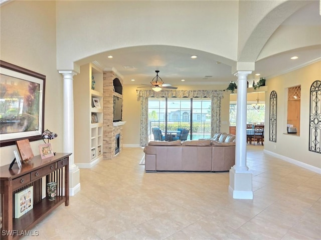 11573 SW Dallas Dr N, Lake Suzy, FL 34269 - living room featuring ornate columns, ceiling fan, recessed lighting, and built in shelves