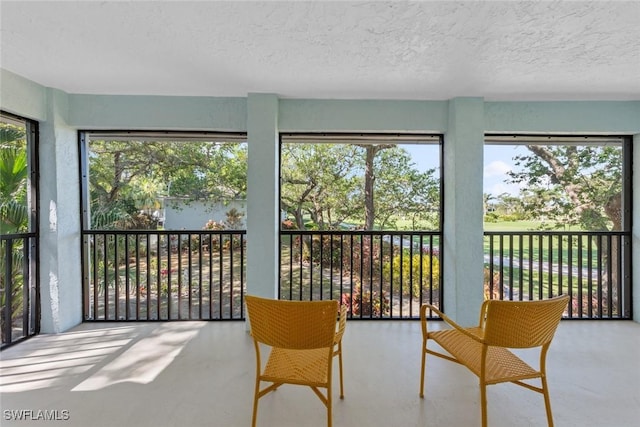 sunroom / solarium featuring a healthy amount of sunlight