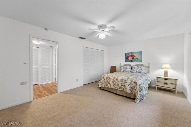 bedroom featuring baseboards, visible vents, carpet floors, ceiling fan, and a closet