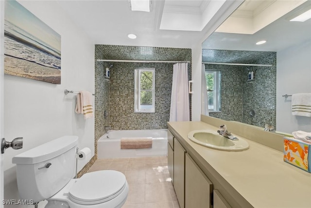 full bathroom with tile patterned floors, toilet, ornamental molding, tiled shower / bath combo, and vanity