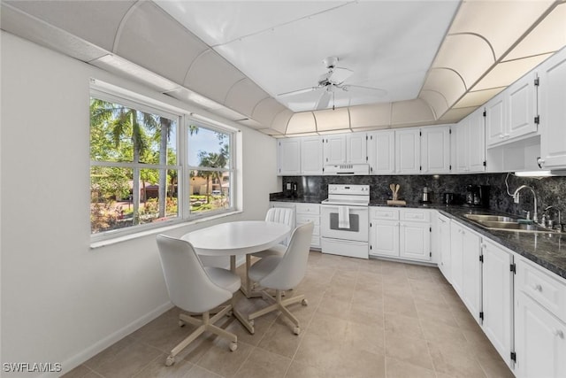 kitchen featuring backsplash, ceiling fan, white cabinets, white electric stove, and a sink