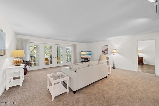 living area with french doors, baseboards, and carpet flooring