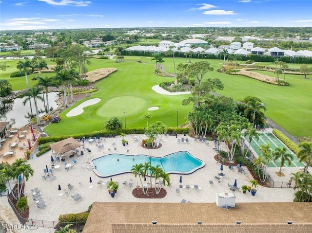 birds eye view of property with view of golf course