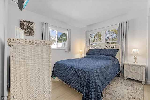 bedroom with wood finished floors