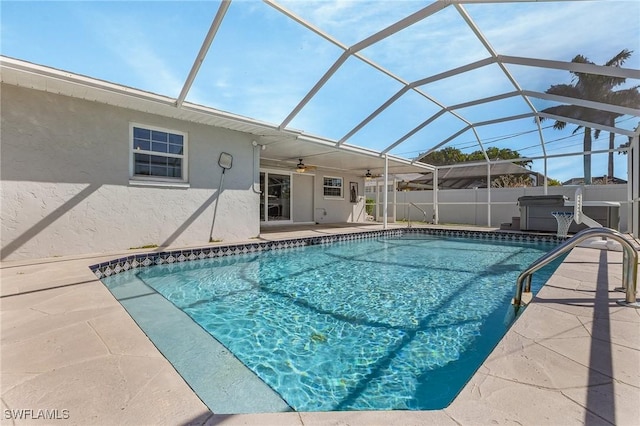 view of pool with a fenced in pool, a hot tub, ceiling fan, a lanai, and a patio