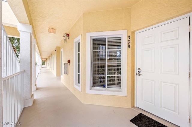 entrance to property with stucco siding