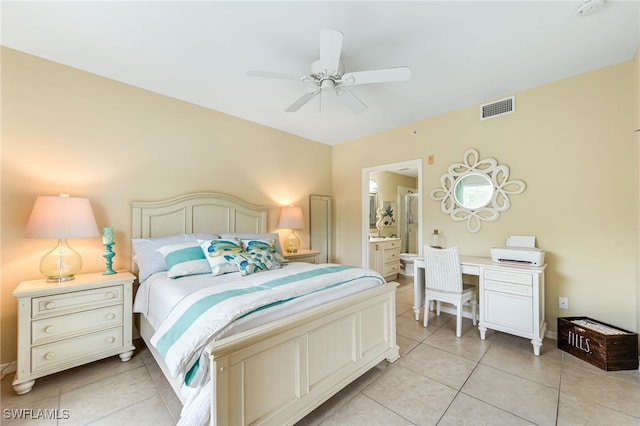 bedroom featuring light tile patterned flooring, visible vents, connected bathroom, and ceiling fan