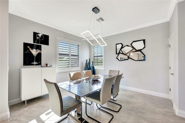 dining area featuring visible vents, baseboards, and ornamental molding