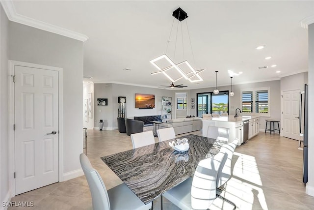 dining room featuring recessed lighting, baseboards, crown molding, and a ceiling fan