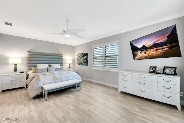 bedroom featuring a ceiling fan, baseboards, visible vents, light wood finished floors, and ornamental molding