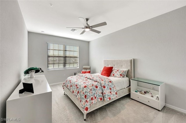 bedroom featuring a ceiling fan, visible vents, carpet floors, and baseboards