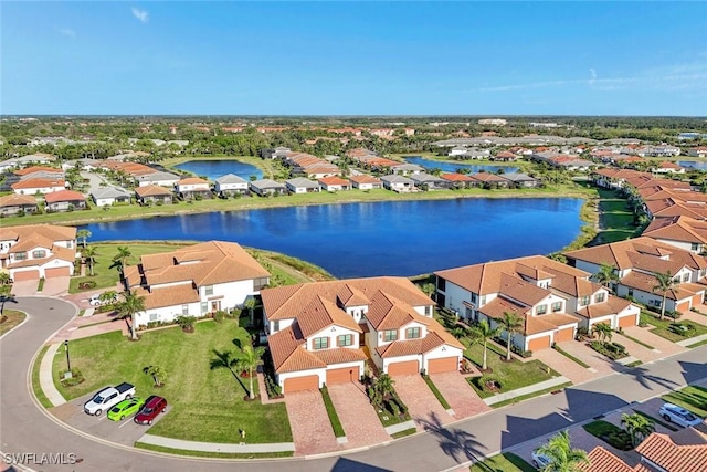 bird's eye view featuring a residential view and a water view