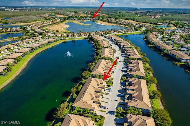 aerial view featuring a residential view and a water view