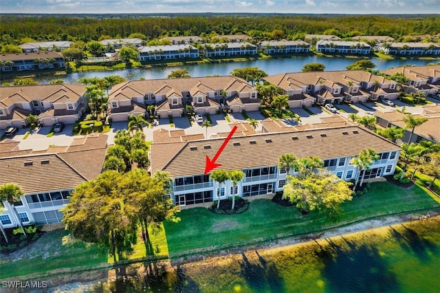 aerial view featuring a residential view and a water view