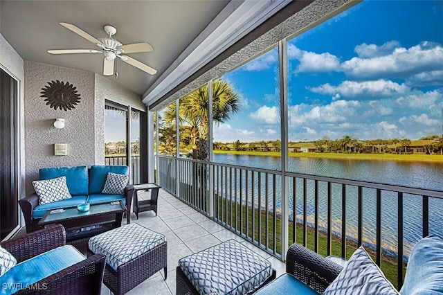 balcony with a water view, ceiling fan, and an outdoor hangout area