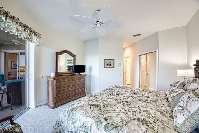 carpeted bedroom featuring access to exterior, a ceiling fan, baseboards, and visible vents