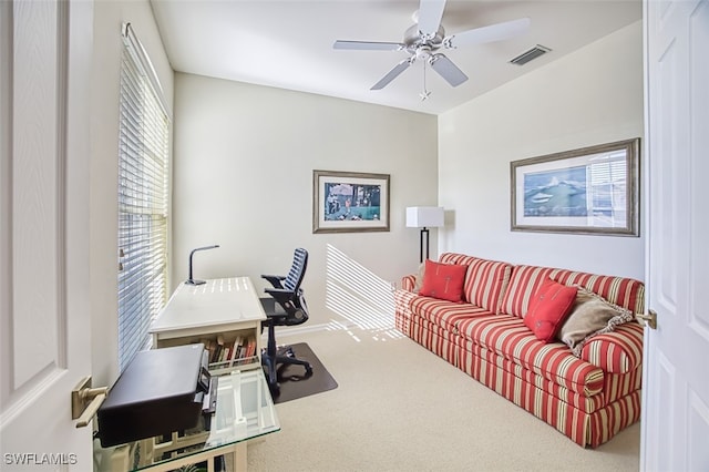 office area with visible vents, a ceiling fan, and carpet floors