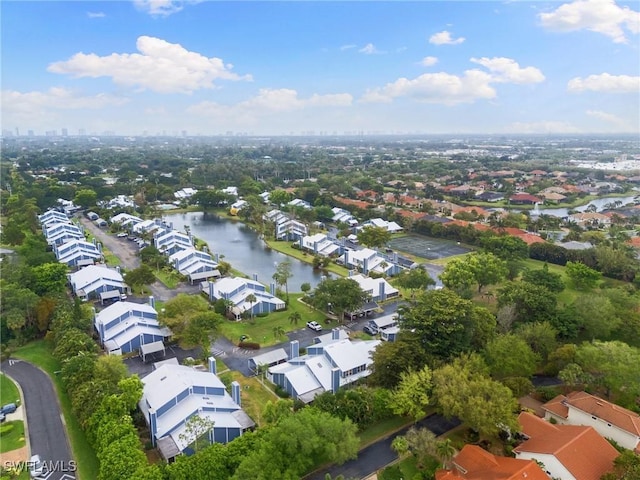 birds eye view of property with a residential view and a water view