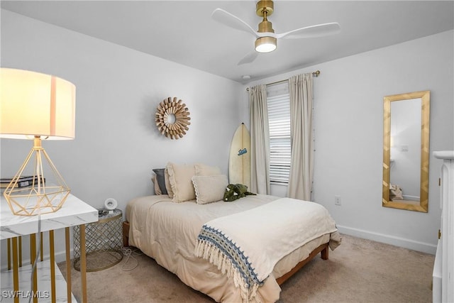 carpeted bedroom featuring baseboards