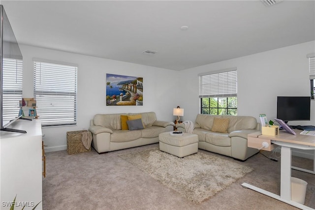 living room featuring visible vents and carpet floors