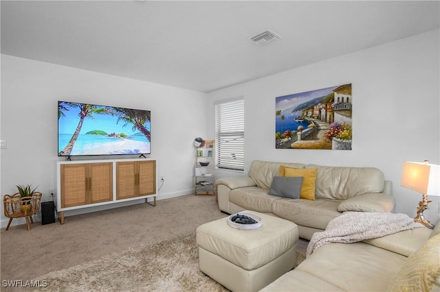 carpeted living room featuring baseboards and visible vents