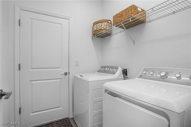 laundry area featuring laundry area and separate washer and dryer