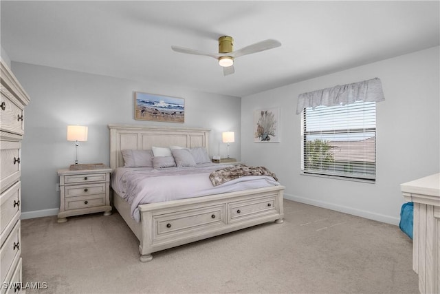 bedroom featuring ceiling fan, baseboards, and light carpet