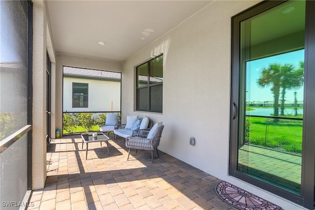 sunroom / solarium featuring a healthy amount of sunlight