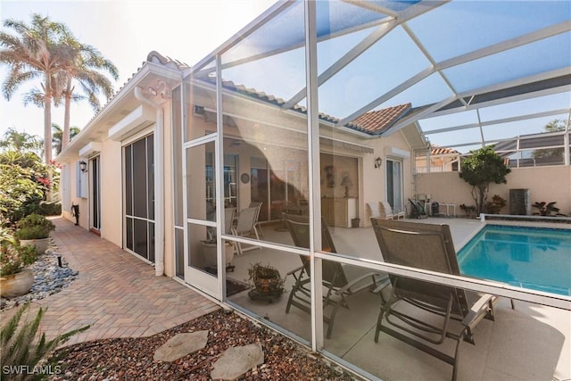 view of pool featuring a lanai, a fenced in pool, and a patio