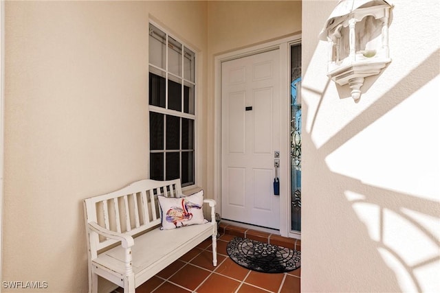 view of exterior entry featuring stucco siding