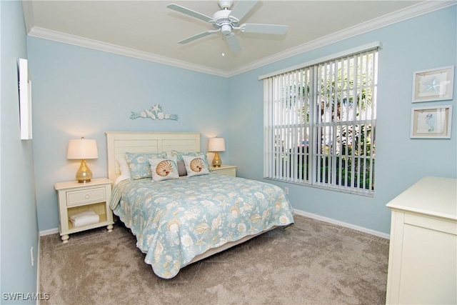 carpeted bedroom with ceiling fan, baseboards, and ornamental molding