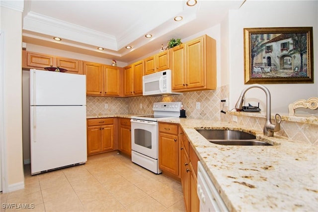 kitchen featuring backsplash, crown molding, light stone countertops, white appliances, and a sink