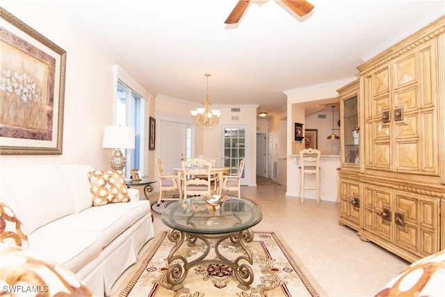 living room with light tile patterned floors, ceiling fan with notable chandelier, and ornamental molding