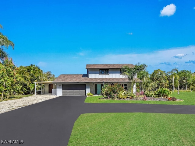 1831 Seminole Harbor Dr, Alva, FL 33920 - view of front of home featuring aphalt driveway, an attached garage, and a front yard